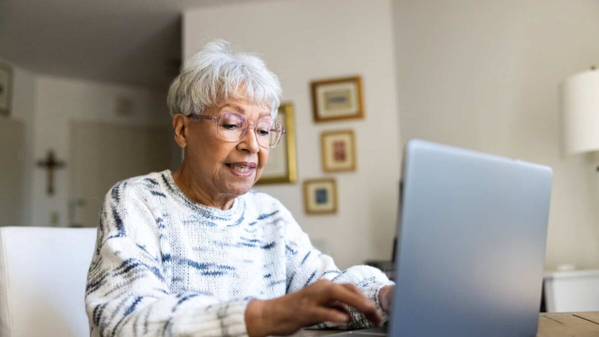 Senior uses a laptop computer