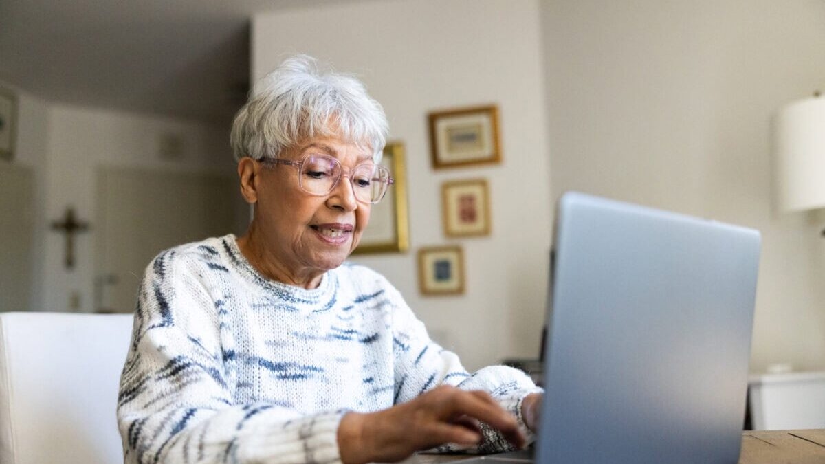 Senior uses a laptop computer